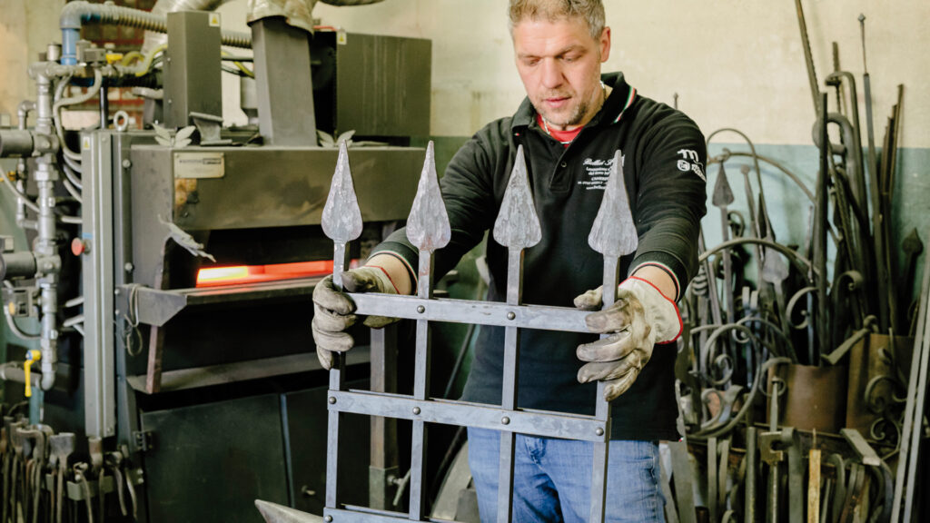 Stefano Bellesi in his workshop dedicated to artistic wrought iron in Camerino.